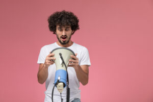 front-view-young-woman-looking-inside-hand-microphone